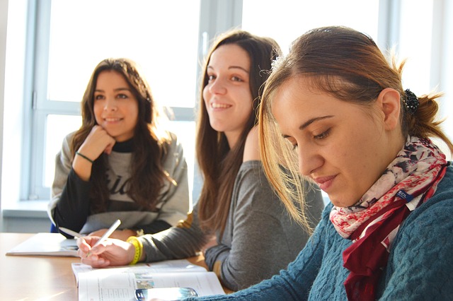 image of three homestay students learning language