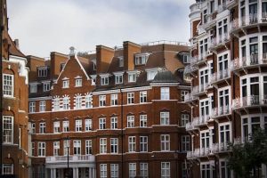 row of red brick houses in london