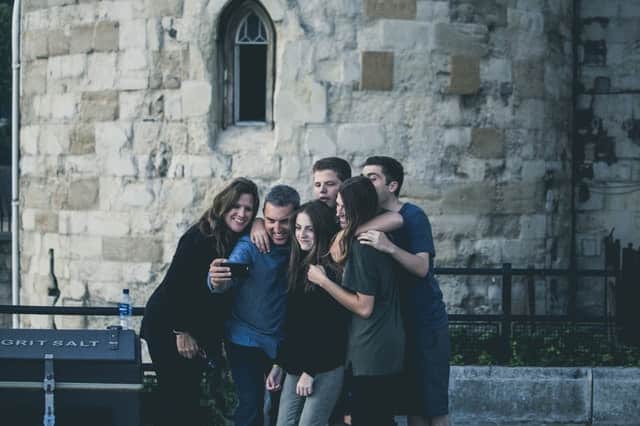 family posing in front of castle