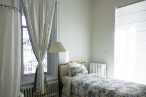 bedroom with white walls and bed