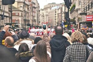 tourists in london taking pictures